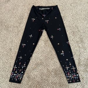 Black leggings with some gem patterns.